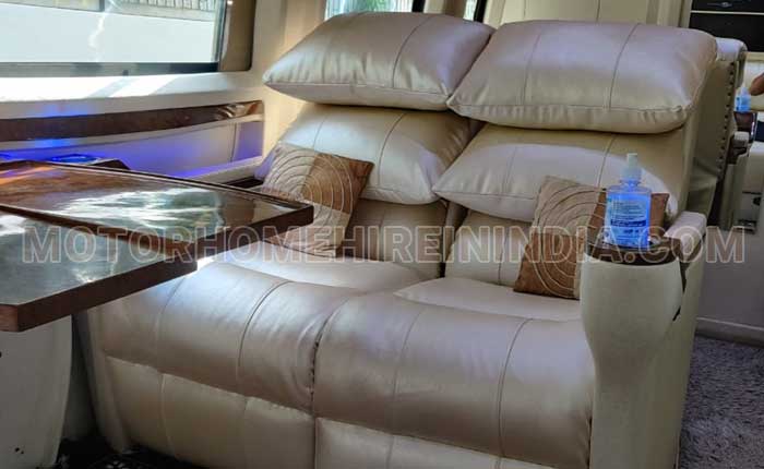 caravan hire with toilet washroom reclining seats with sofa seating hire delhi